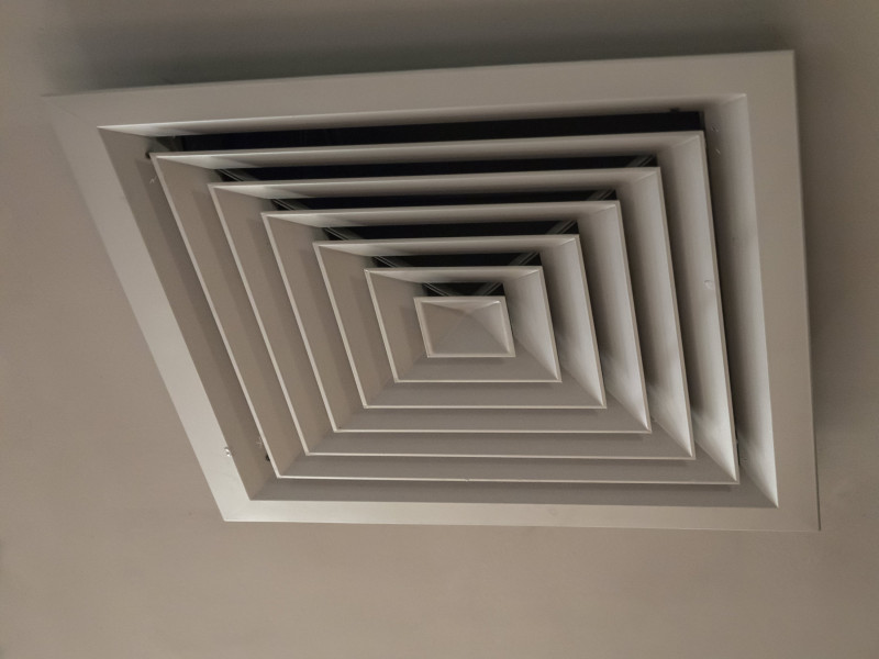 Ducted air conditioning vent in roof of home.