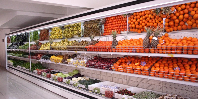 grocery store commercial fridges with fruit.